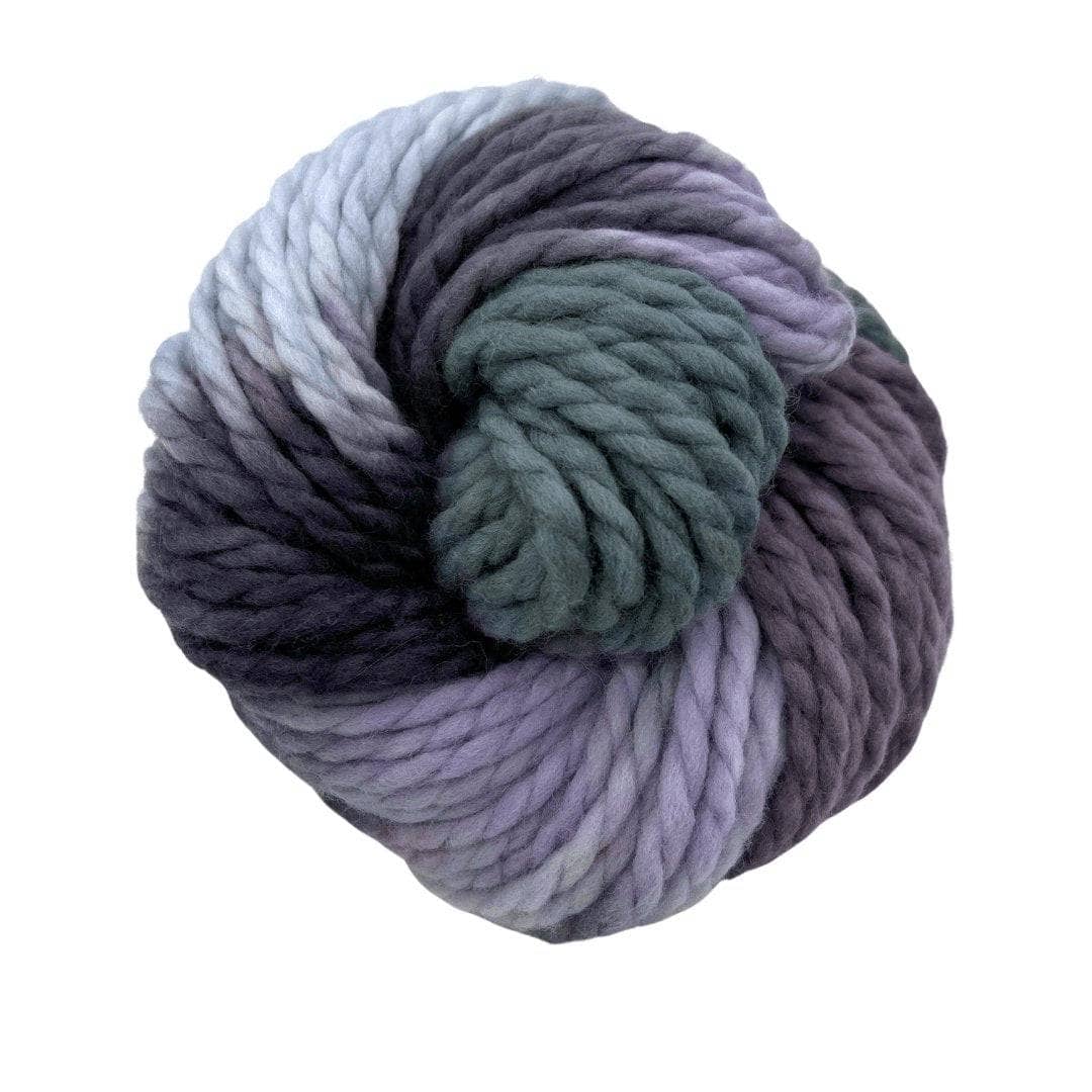 Multi cool neutral toned bulky yarn on a white background