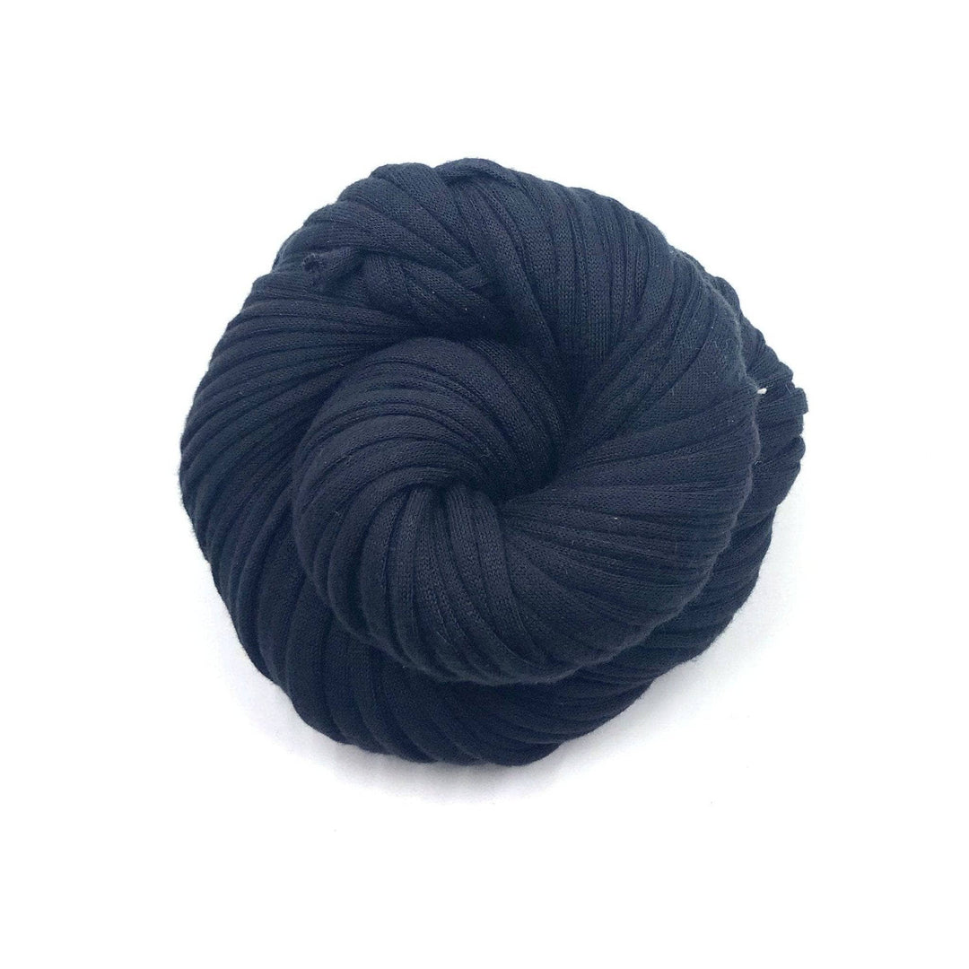 Cotton t-shirt yarn donut ball in black on white background
