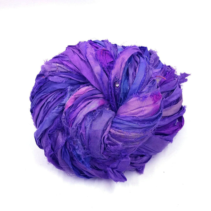 Sari Silk Ribbon Yarn ball in Ultra Violet on a white background