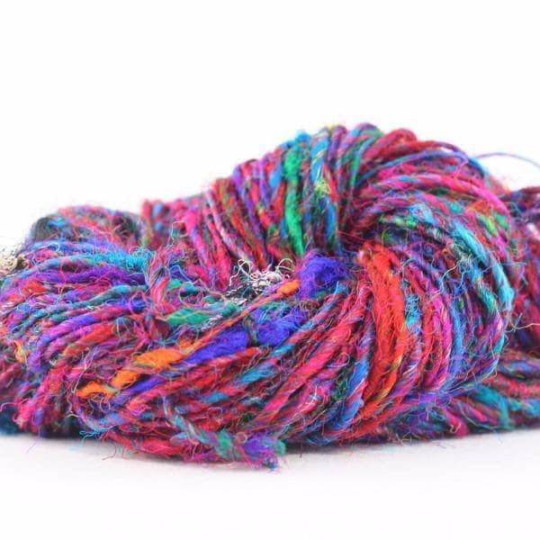 Close up of multicolored Recycled Silk Yarn on a white background