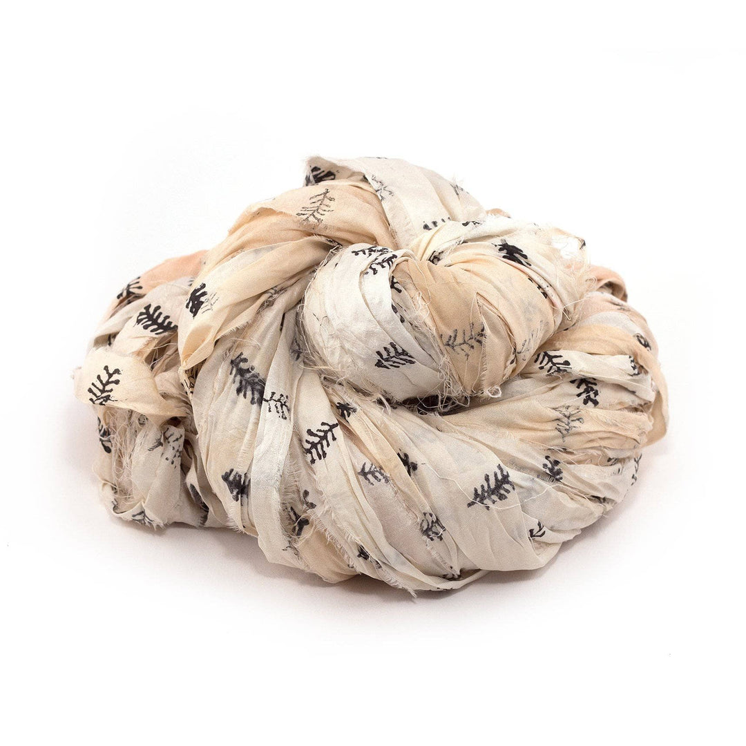 Block Printed Handmade Sari Silk Ribbon ball in The Feather (black and cream) on a white background