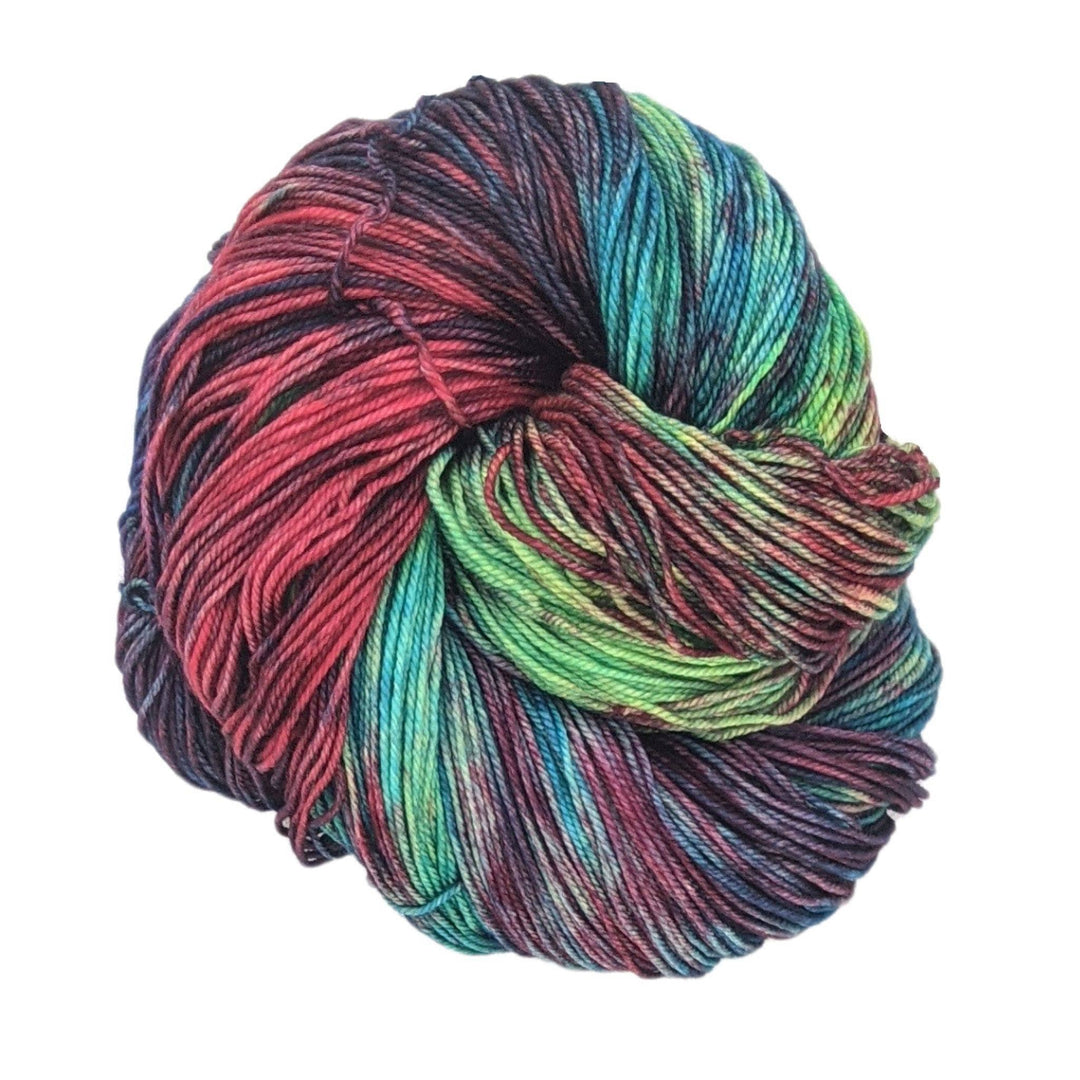 hank of tonal multicolor yarn in front of a white background.