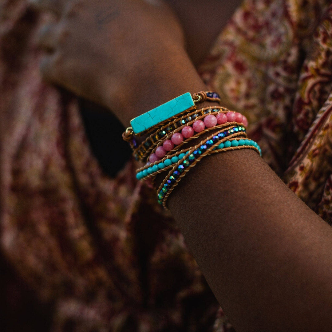 model wearing turquoise and pink beaded wrap bracelet