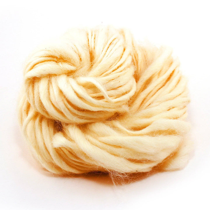 White thick and thin wool yarn ball on a white background