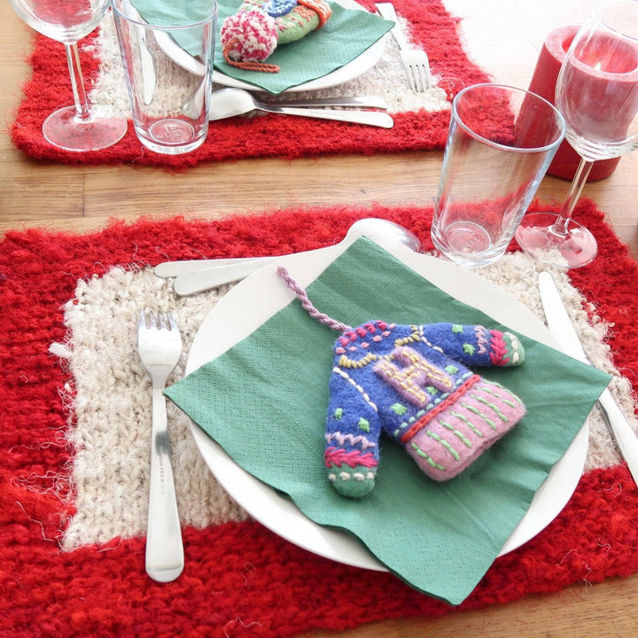 red and white placemat on a wooden table