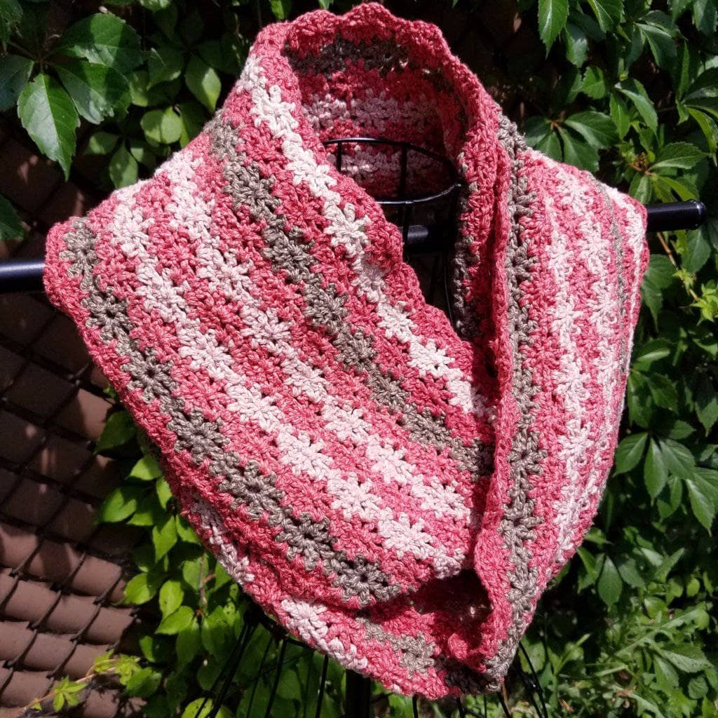 Vintage Rose Infinity Scarf hanging in front of greenery