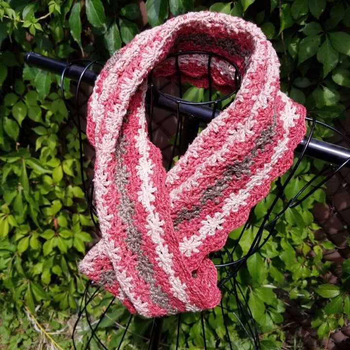 Vintage Rose Infinity Scarf hanging in front of greenery