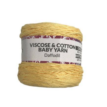 Viscose & Cotton Baby Yarn cake in Daffodil (yellow) on a white background