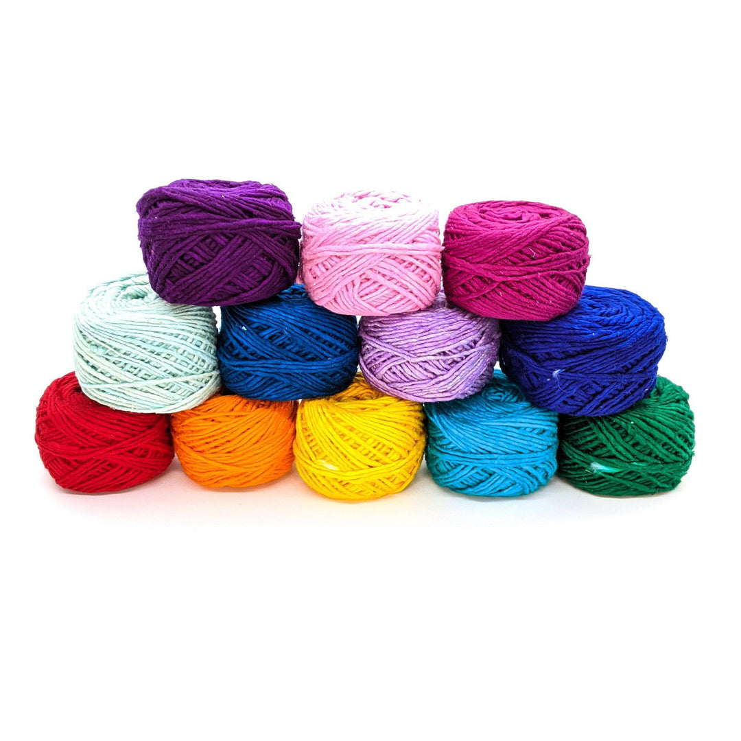 12 skeins of yarn of yarn on a white background