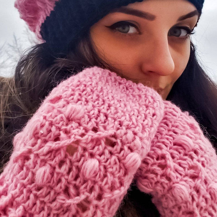 Woman wearing X's and O's Beanie and Mittens in pink