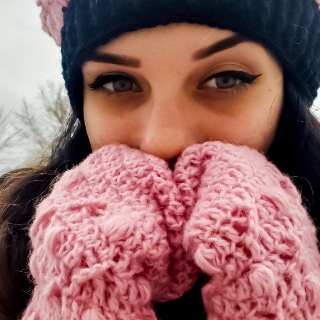 Woman wearing X's and O's Beanie and Mittens in pink