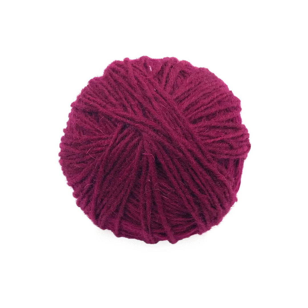 Yak Wool Yarn from Nepal in Mulberry (reddish purple) on a white background