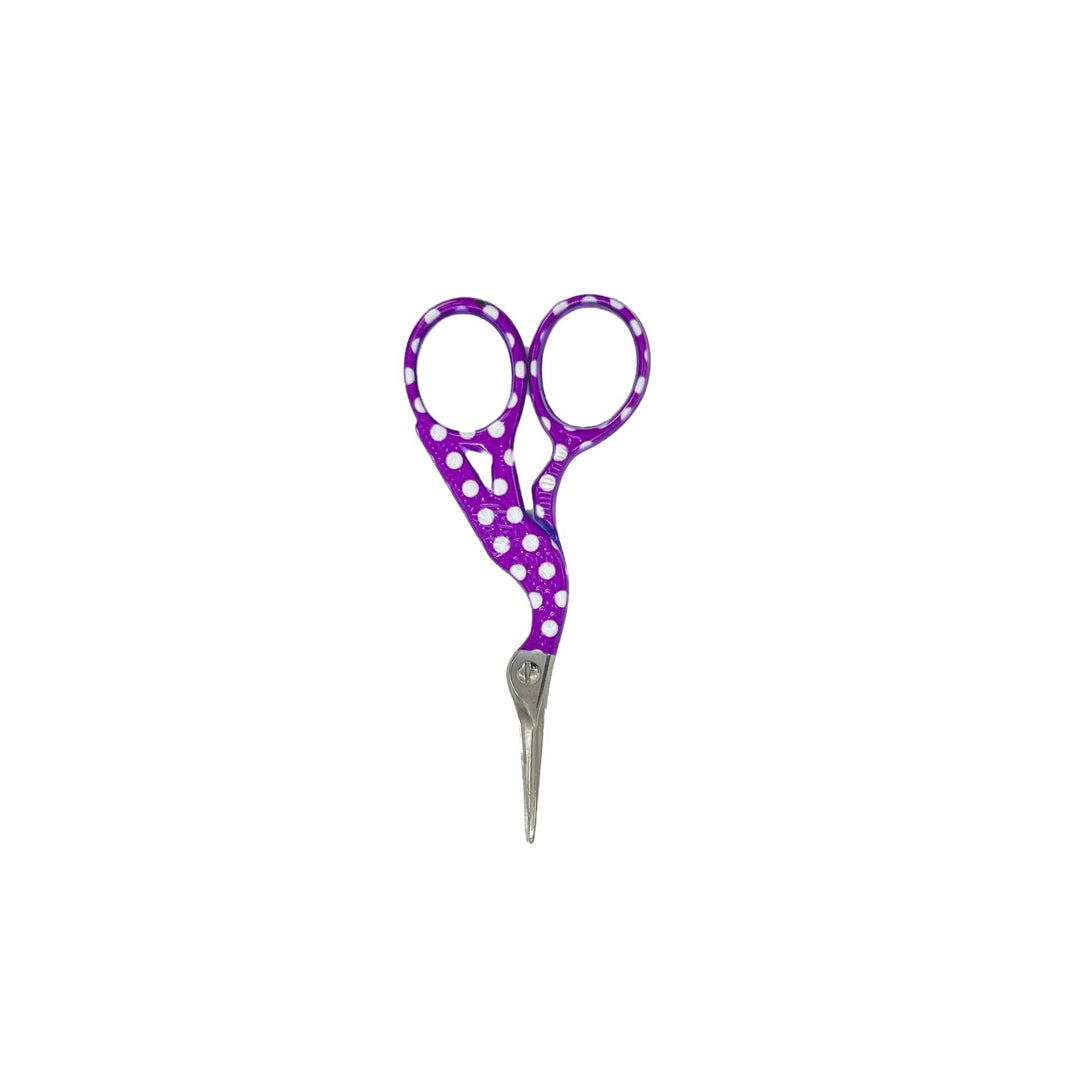 Craft scissors with a curve at the handle. Handle is purple with white polka dots.