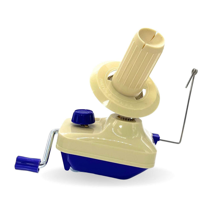 a cream and purple yarn ball winder on a white background