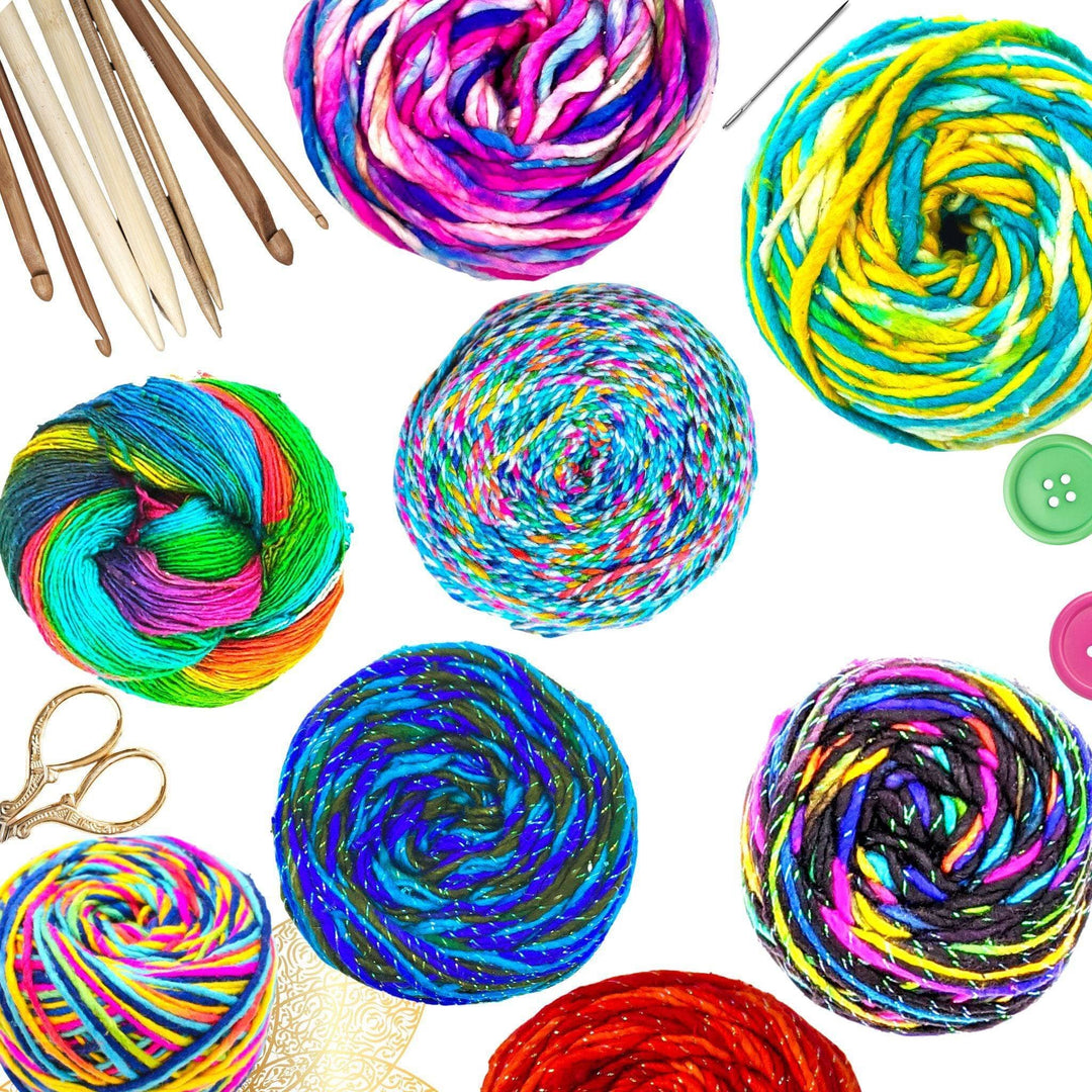 Multiple skeins of colorful, twisted, and sparkly handmade sari silk yarn. Needles, hooks, buttons, and scissors are poking out the sides of the background.