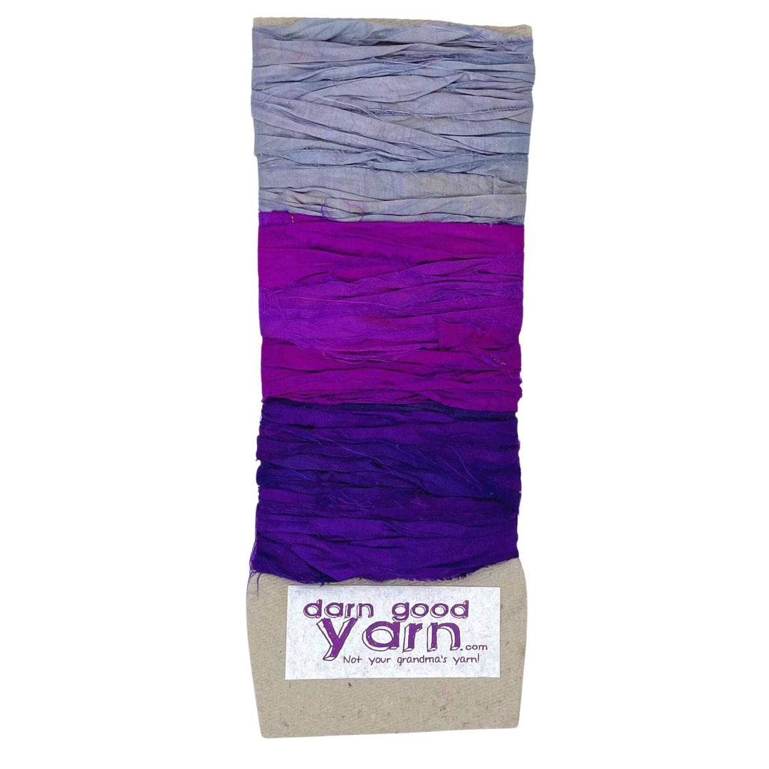 3 shades of purple sari silk ribbon yarn on a white background