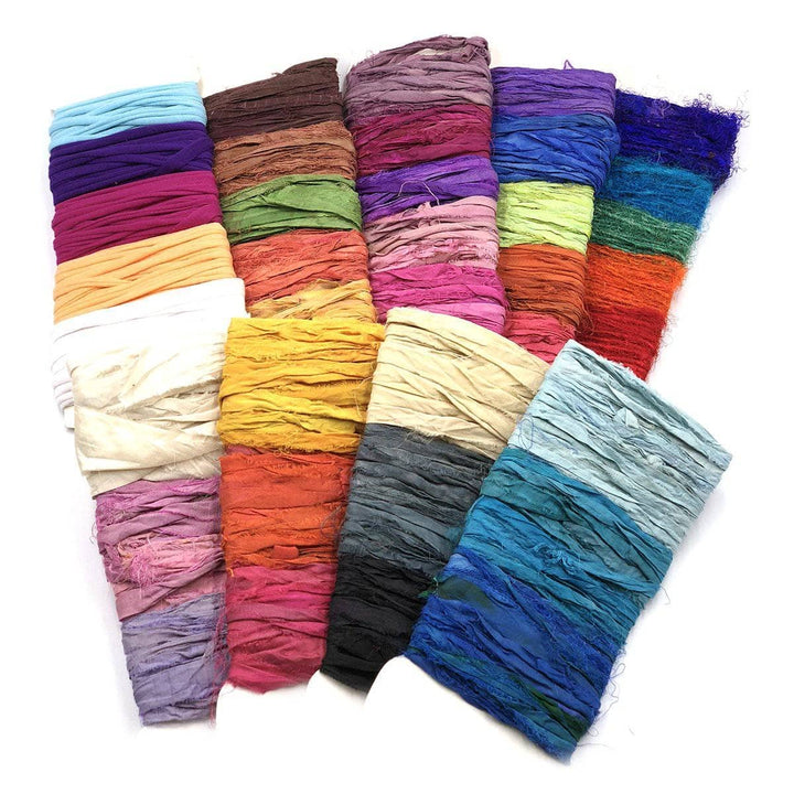 Full Set 9 pack of Yarn & Ribbon Sample Card Bundles in 37 colors on a white background